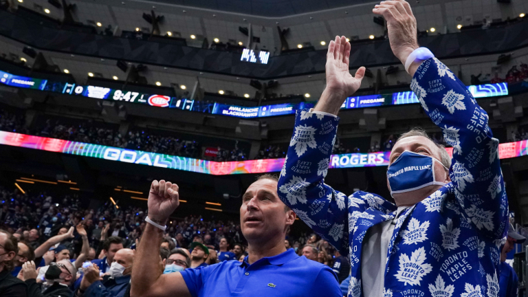 Toronto Maple Leafs fans celebrate their team's first goal of the game against the Montreal Canadiens during first period NHL action in Toronto on Wednesday, October 13, 2021. (CP/file)