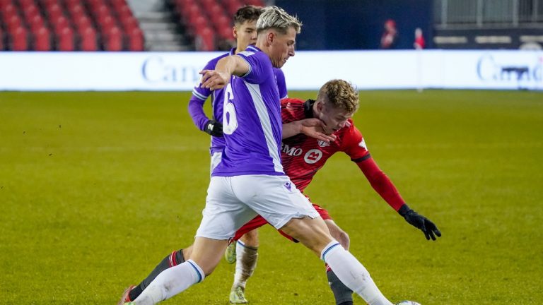 Pacific FC defender Lukas MacNaughton (6) defends Toronto FC forward Jacob Shaffelburg (24) during second half Canadian Championship semifinal action in Toronto on Wednesday, November 3, 2021. (Evan Buhler/CP) 
