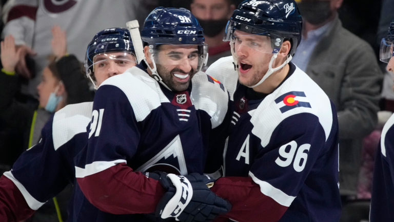 Colorado Avalanche center Nazem Kadri, left, congratulates right wing Mikko Rantanen after his third goal of the night against the Nashville Predators, Saturday, Nov. 27, 2021, in Denver. (AP/file) 