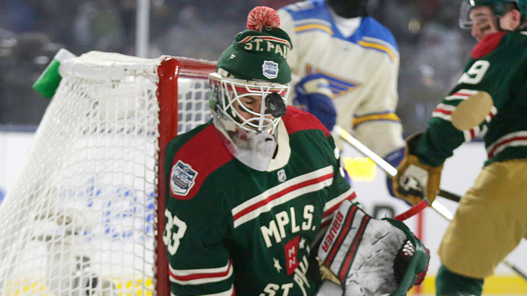 Minnesota Wild goaltender Cam Talbot is hit by the puck during the first period of the team's NHL Winter Classic hockey game against the St. Louis Blues on Saturday, Jan. 1, 2022, in Minneapolis. (AP)