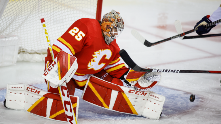 Calgary Flames goalie Jacob Markstrom grabs for a loose puck during second period against the Florida Panthers in Calgary, Tuesday, Jan. 18, 2022. (CP/file)