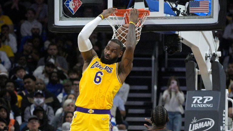 Los Angeles Lakers forward LeBron James (6) dunks in front of Orlando Magic center Mo Bamba, right, during the second half of an NBA basketball game, Friday, Jan. 21, 2022, in Orlando, Fla. (Phelan M. Ebenhack/AP) 
