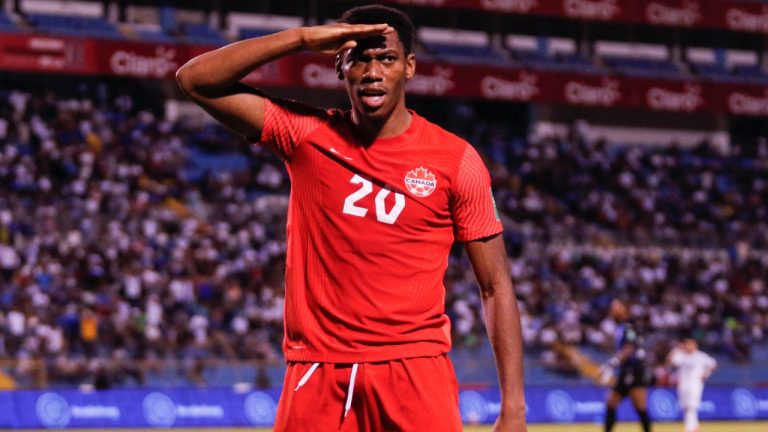 Canada's Jonathan David celebrates scoring his side's second goal against Honduras during a qualifying soccer match for the FIFA World Cup Qatar 2022 in San Pedro Sula, Honduras, Thursday, Jan. 27, 2022. (Delmer Martinez/AP)