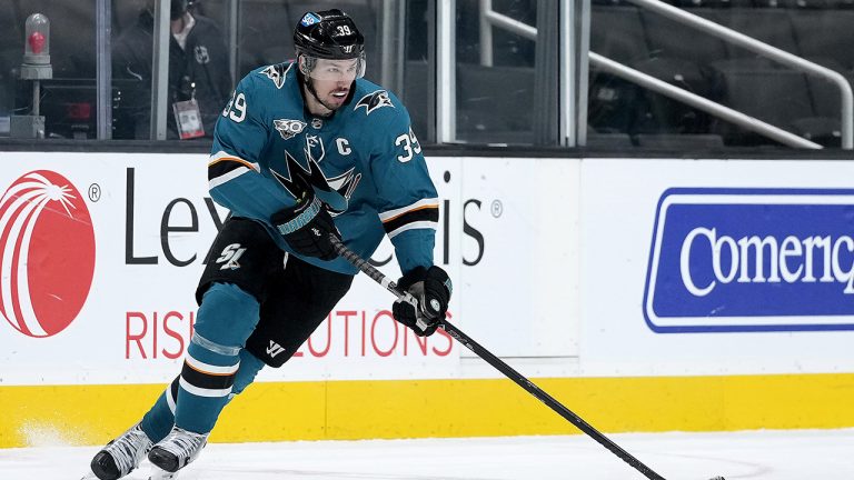 FILE- In this April 13, 2021, file photo, San Jose Sharks centre Logan Couture (39) skates with the puck against the Anaheim Ducks. (Tony Avelar, File/AP)