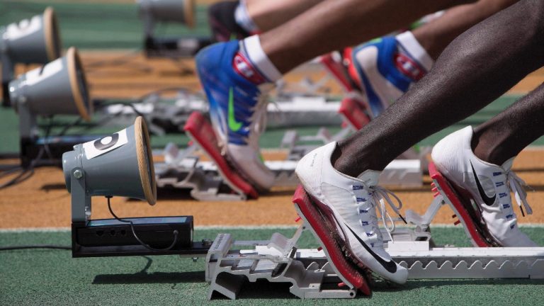 Athletes line up on the starting blocks at the Canadian Track and Field Championships and Selection Trials for the Summer Olympic and Paralympic Games. (Jason Franson/CP)