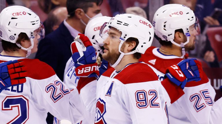 Montreal Canadiens left wing Jonathan Drouin (92) high-fives his teammates after scoring a goal against the Florida Panthers during the first period of an NHL hockey game, Saturday, Jan. 1, 2022, in Sunrise, Fla. (Michael Reaves/AP) 