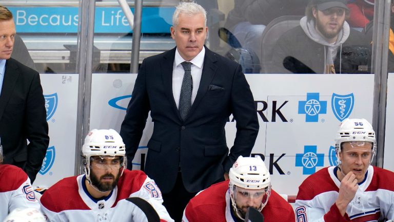 Montreal Canadiens head coach Dominique Ducharme stands behind his bench during the third period of an NHL hockey game against the Pittsburgh Penguins in Pittsburgh, Tuesday, Dec. 14, 2021. The Penguins won 5-2.(Gene J. Puskar/AP Photo) 
