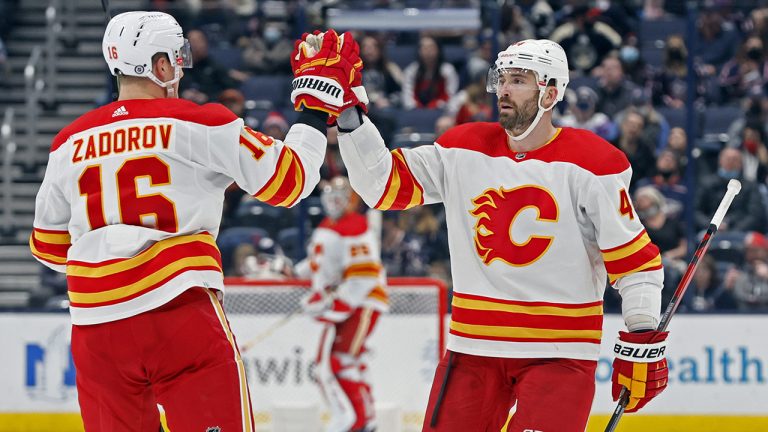 Calgary Flames' Erik Gudbranson, right, celebrates his goal against the Columbus Blue Jackets with teammate Nikita Zadorov. (Jay LaPrete/AP)