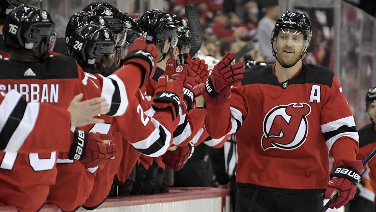 New Jersey Devils defenceman Dougie Hamilton, right, celebrates his goal with teammates during the first period of an NHL hockey game against the Philadelphia Flyers. (Bill Kostroun/AP)