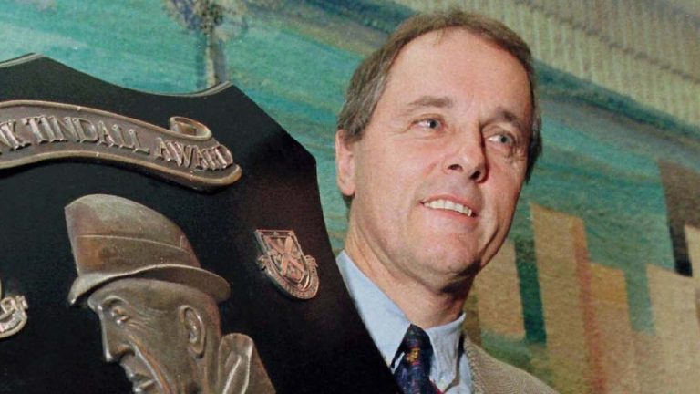 Larry Haylor holds his award after winning the Frank Tindall Trophy for coach of the year in Toronto in 1998. (CP PHOTO) 