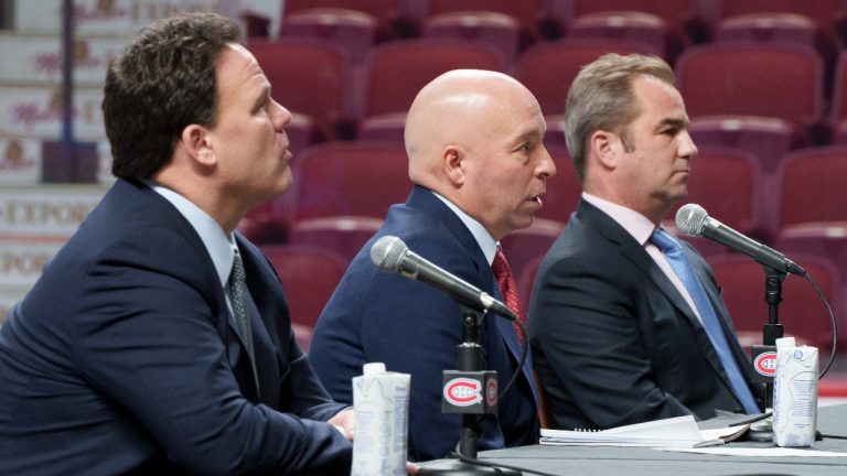 New Montreal Canadiens general manager Kent Hughes, centre, responds to question next to owner Geoff Molson, right, and Jeff Gorton, executive vice-president of hockey operations during a news conference in Montreal on Wednesday, January 19, 2022. (Paul Chiasson/THE CANADIAN PRESS)
