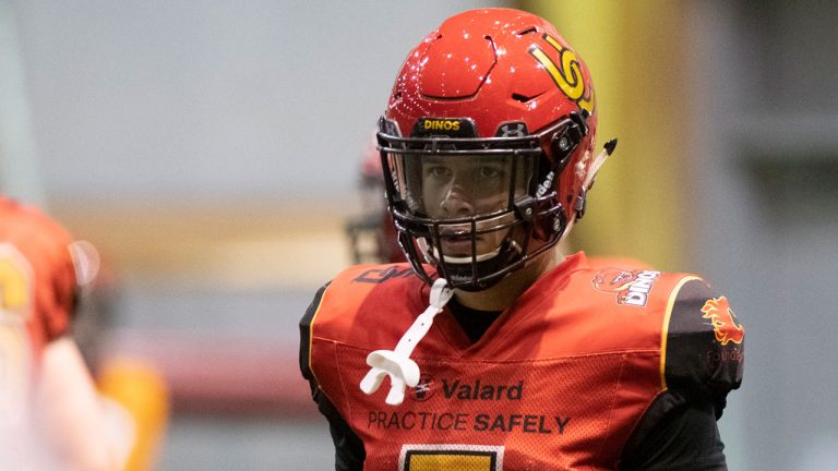 Calgary University Dinos Jalen Philpot, right, looks on during team practice in preparation of the Vanier Cup. (Jacques Boissinot/CP)