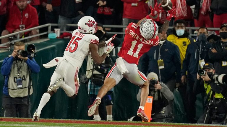 Ohio State wide receiver Jaxon Smith-Njigba (11) catches a touchdown in front of Utah cornerback Malone Mataele (15) during the second half in the Rose Bowl NCAA college football game Saturday, Jan. 1, 2022, in Pasadena, Calif (Mark J. Terrill/AP).