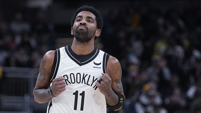 Brooklyn Nets' Kyrie Irving reacts after hitting a shot during the second half of the team's NBA basketball game against the Indiana Pacers. (Darron Cummings/AP)