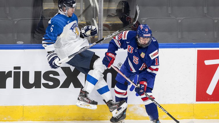 United States' Logan Cooley (18) checks Finland's Eemil Viro (6) during second period IIHF World Junior Hockey Championship exhibition action in Edmonton. (Jason Franson/CP)