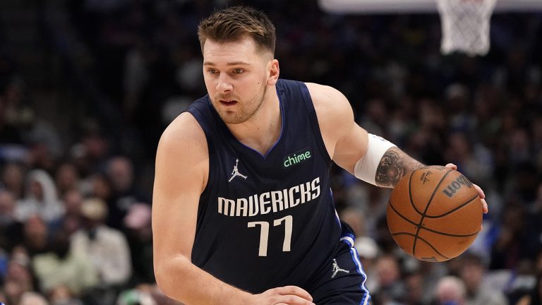 Dallas Mavericks guard Luka Doncic (77) dribbles during the first quarter of an NBA basketball game against the Golden State Warriors. (LM Otero/AP)