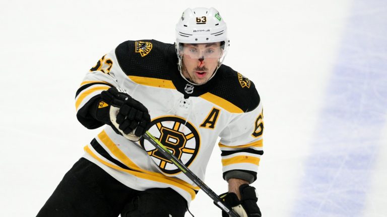 Boston Bruins left wing Brad Marchand (63) skates during the third period of an NHL hockey game against the Washington Capitals, Monday, Jan. 10, 2022, in Washington. (Nick Wass/AP Photo) 
