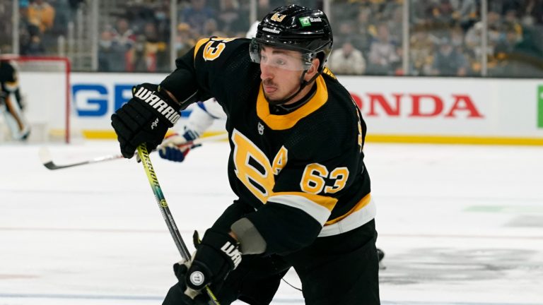 Boston Bruins' Brad Marchand lets go with a shot against the New York Rangers during the first period of an NHL hockey game Friday, Nov. 26, 2021, in Boston. (Winslow Townson/AP) 