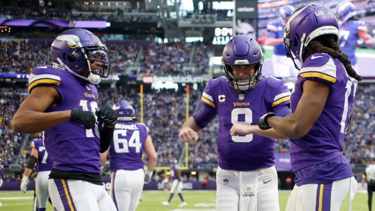 Minnesota Vikings wide receiver K.J. Osborn, right, celebrates with teammates wide receiver Justin Jefferson, left, and quarterback Kirk Cousins (8) after catching a 21-yard touchdown pass during the second half of an NFL football game against the Chicago Bears, Sunday, Jan. 9, 2022, in Minneapolis. (Bruce Kluckhohn/AP)