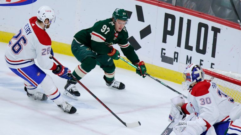 Minnesota Wild left wing Kirill Kaprizov (97) skates past Montreal Canadiens goaltender Cayden Primeau (30) with defense from Montreal Canadiens defenseman Jeff Petry (26) in the first period of an NHL hockey game Monday, Jan. 24, 2022, in St. Paul, Minn. (Andy Clayton-King/AP)