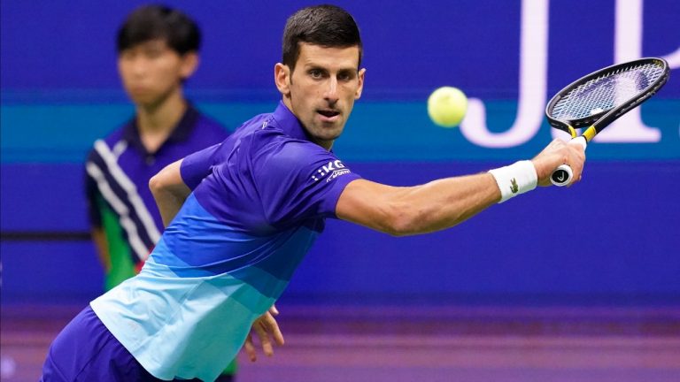 Novak Djokovic, of Serbia, returns a shot to Alexander Zverev, of Germany, during the semifinals of the US Open tennis championships, Friday, Sept. 10, 2021, in New York. (Elise Amendola/AP)