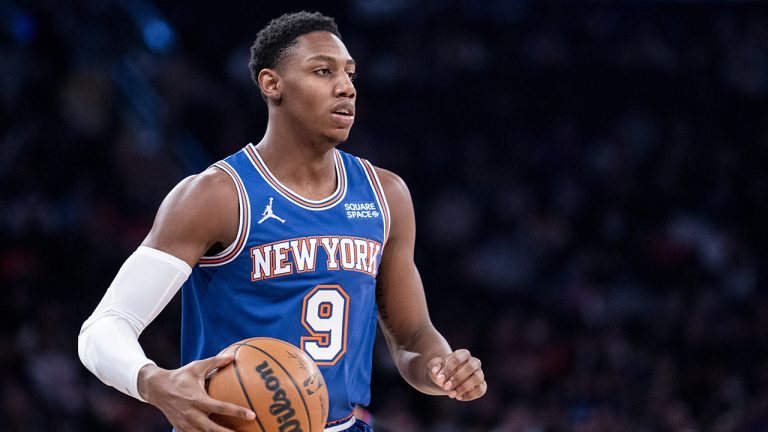 New York Knicks guard RJ Barrett (9) dribbles the ball up the court during the first half of an NBA basketball game against the Los Angeles Clippers. (John Minchillo/AP)