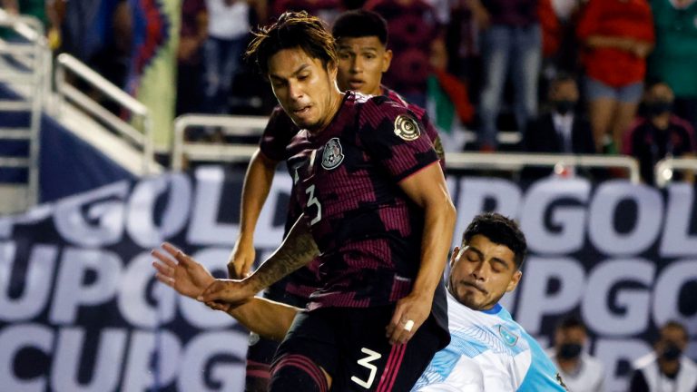 Mexico defender Carlos Salcedo (3) defends as Guatemala forward Darwin Lom (14) tires to make a shot during the first half of a CONCACAF Gold Cup Group A soccer match in Dallas, Wednesday, July 14, 2021. (Michael Ainsworth/AP) 