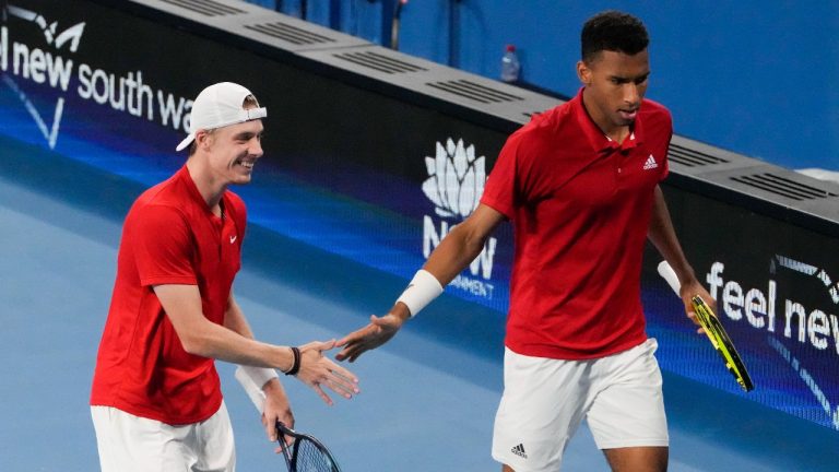 Canada's Denis Shapovalov and teammate Felix Auger-Aliassime, right, celebrate after winning. (Mark Baker/AP Photo) 
