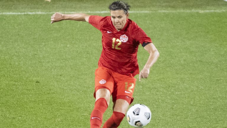 Canada’s Christine Sinclair plays a pass during first half Celebration Tour soccer action against New Zealand. (Graham Hughes/CP)