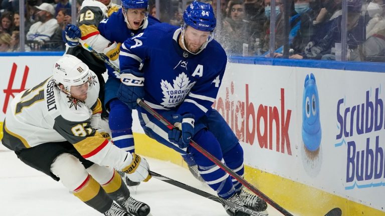 Toronto Maple Leafs defenceman Morgan Rielly (44) clears the puck under pressure from Vegas Golden Knights forward Jonathan Marchessault (81) during third period NHL action on Tuesday, November 2, 2021. (Evan Buhler/CP)