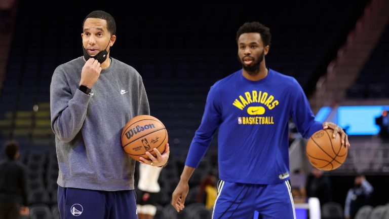 Golden State Warriors assistant coach and director of player development Jama Mahlalela, left, stands next to Golden State Warriors forward Andrew Wiggins during practice before an NBA basketball game against the Detroit Pistons in San Francisco, Tuesday, Jan. 18, 2022. (Jed Jacobsohn/AP)