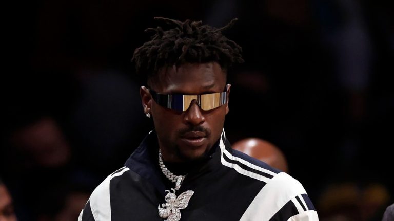 Former Tampa Bay Buccaneers wide receiver Antonio Brown arrives courtside during the second half of an NBA basketball game between the Memphis Grizzlies and the Brooklyn Nets, Monday, Jan. 3, 2022, in New York. (Adam Hunger/AP Photo) 
