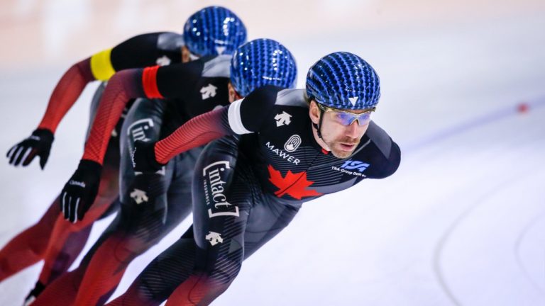 Canada's Ted-Jan Bloemen, right, leads teammates Connor Howe, centre, and Jordan Belchos during the men's team pursuit competition at the ISU World Cup speed skating event in Calgary, Alta., Sunday, Dec. 12, 2021. (Jeff McIntosh/CP)