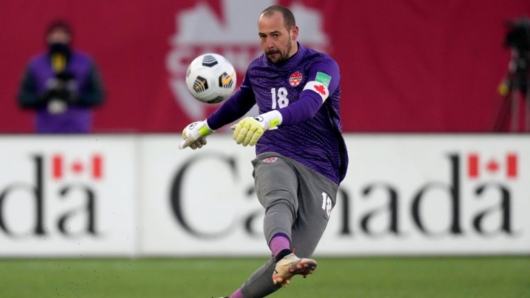 Canada's Milan Borjan (18) makes a free kick during second half World Cup qualifying soccer action against the United States, in Hamilton, Ont., Sunday, Jan. 30, 2022. (Frank Gunn/CP)