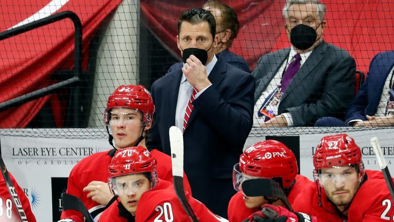 Carolina Hurricanes coach Rod Brind 'Amour, centre, watches play from behind the bench during the third period of the team's NHL hockey game against the Detroit Red Wings in Raleigh, N.C., Thursday, April 29, 2021. (Karl B DeBlaker/AP)