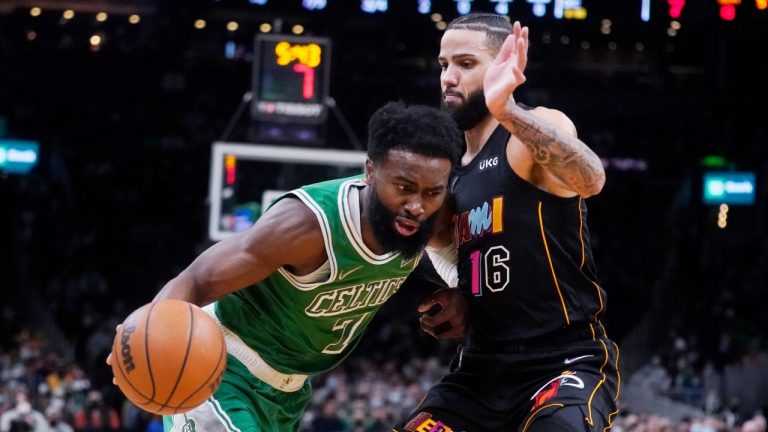 Boston Celtics guard Jaylen Brown (7) drives to the basket against Miami Heat forward Caleb Martin (16) during the first half of an NBA basketball game, Monday, Jan. 31, 2022, in Boston. (Charles Krupa/AP)