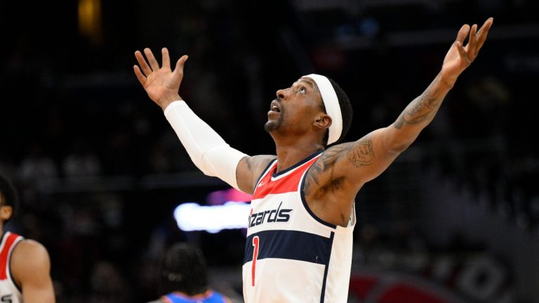 Washington Wizards guard Kentavious Caldwell-Pope (1) reacts after he made a 3-point basket during the second half of an NBA basketball game against the Oklahoma City Thunder, Tuesday, Jan. 11, 2022, in Washington. The Wizards won 122-118. (Nick Wass/AP Photo) 
