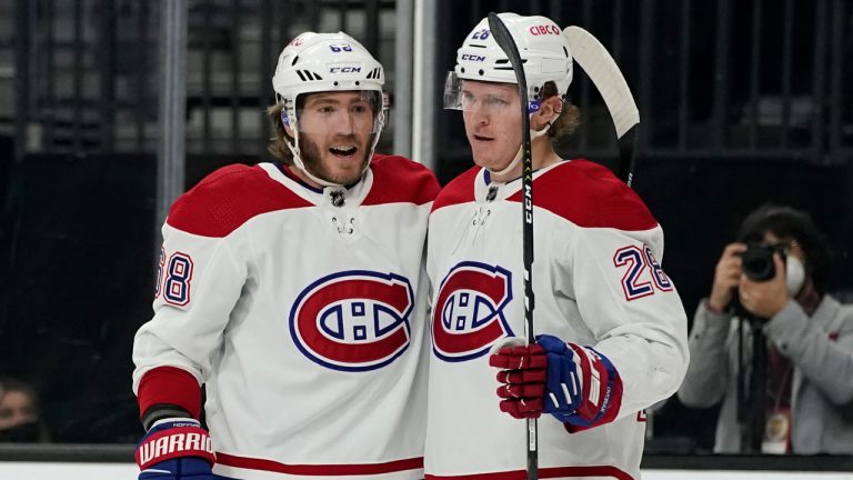 Montreal Canadiens left wing Christian Dvorak (28) celebrates after Montreal Canadiens center Mike Hoffman (68) scored against the Vegas Golden Knights. (John Locher/AP) 