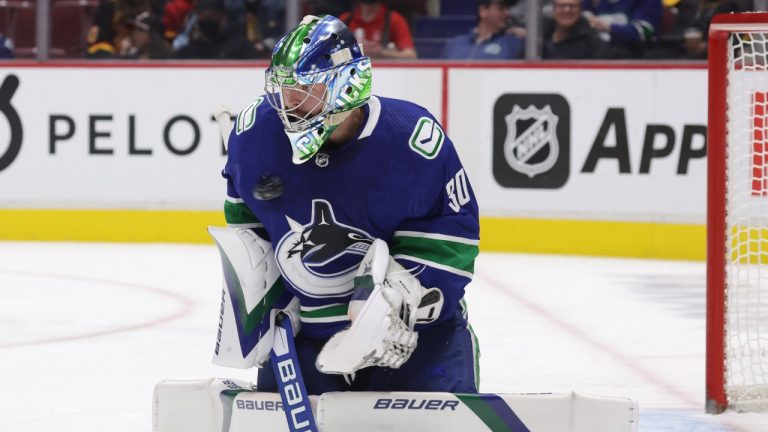 Vancouver Canucks goalie Spencer Martin makes a save during the first period of an NHL hockey game against the Florida Panthers in Vancouver, on Friday, January 21, 2022. (Darryl Dyck/CP)