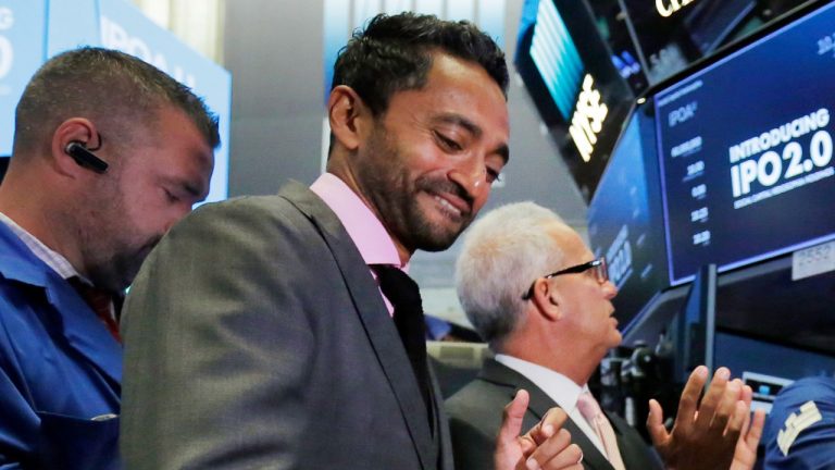 Social Capital Hedosophia Holdings Corp. CEO, Founder and Chairman Chamath Palihapitiya, center, rings a ceremonial bell on the floor of the New York Stock Exchange, Thursday, Sept. 14, 2017. Palihapitiya, a Golden State Warriors NBA basketball team minority owner who said "nobody cares" about the Uyghurs in China, is under fire and the team is distancing itself from him. (Richard Drew/AP)