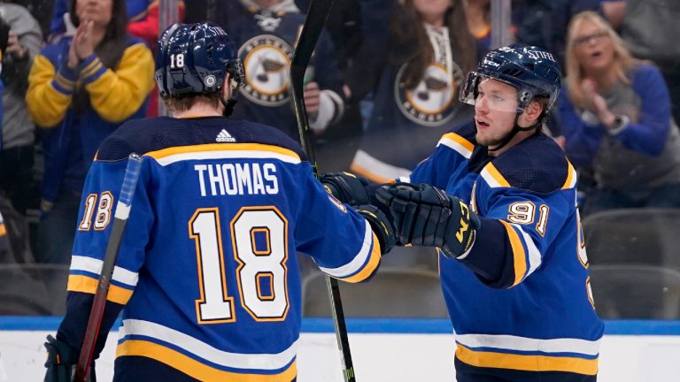 St. Louis Blues' Vladimir Tarasenko (91) is congratulated by Robert Thomas (18) after scoring during the second period of an NHL hockey game against the Edmonton Oilers Wednesday, Dec. 29, 2021, in St. Louis. (Jeff Roberson/AP) 