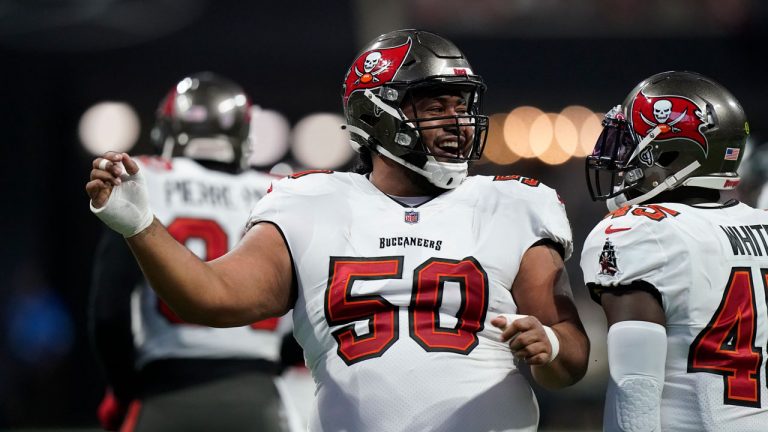 Tampa Bay Buccaneers nose tackle Vita Vea (50) celebrates a sack on Atlanta Falcons quarterback Matt Ryan during the first half of an NFL football game. (Brynn Anderson/AP) 