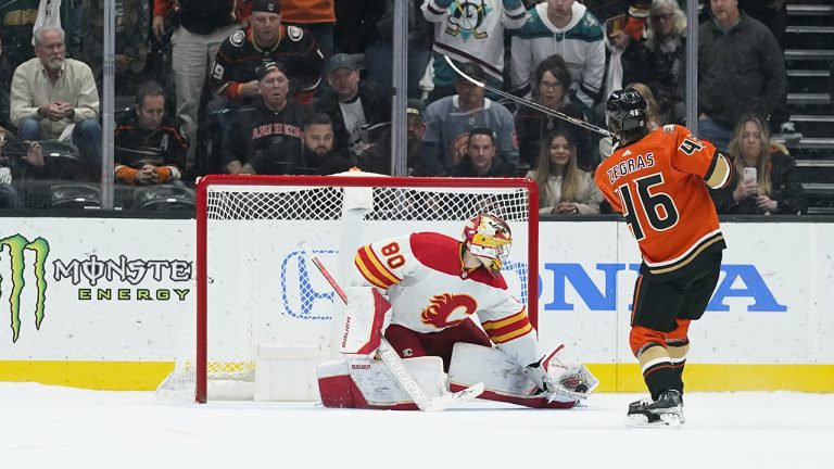 Calgary Flames goaltender Dan Vladar stops a shot by Anaheim Ducks' Trevor Zegras during the shootout in an NHL hockey game. (AP Photo/Jae C. Hong)