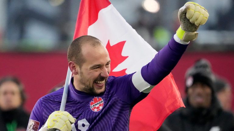 Canada's Milan Borjan (18) celebrates the team's 2-0 victory following second half World Cup qualifying soccer action against the United States, in Hamilton, Ont., Sunday, Jan. 30, 2022. (Frank Gunn/CP)