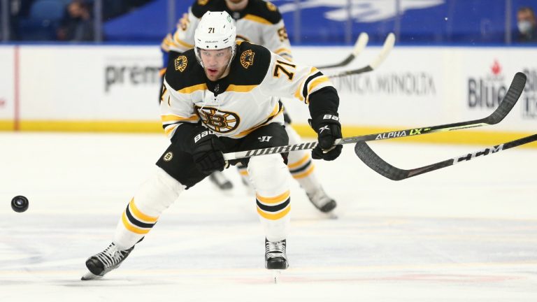 Boston Bruins forward Taylor Hall (71) chases the puck during the first period of an NHL hockey game against the Buffalo Sabres, Thursday, April 22, 2021, in Buffalo, N.Y. (Jeffrey T. Barnes/AP)