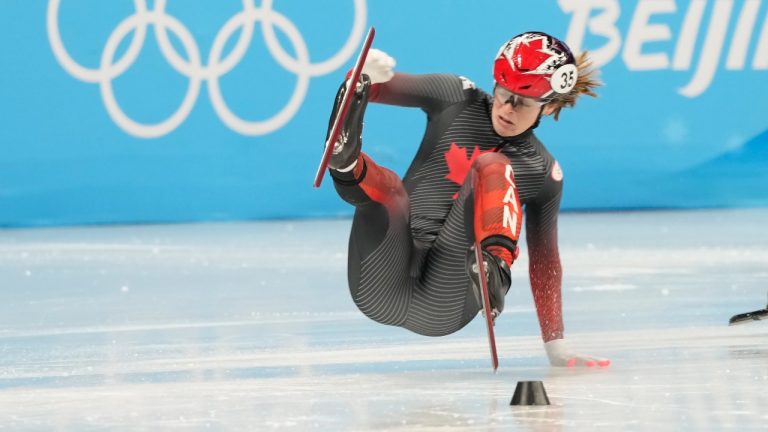 Canada's Kim Boutin wipes out during the women's 1,000-metre short-track speedskating heats at the Beijing Winter Olympics in Beijing, China, on Wednesday, Feb. 9, 2022. (Paul Chiasson/THE CANADIAN PRESS)