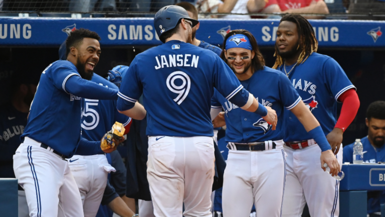 Toronto Blue Jays’ Danny Jansen (9) celebrates with Teoscar Hernandez, left, Bo Bichette and Vladimir Guerrero Jr., right, after hitting a solo home run in the fifth inning of an American League baseball game against the Baltimore Orioles in Toronto on Saturday, Oct. 2, 2021. (CP/file)