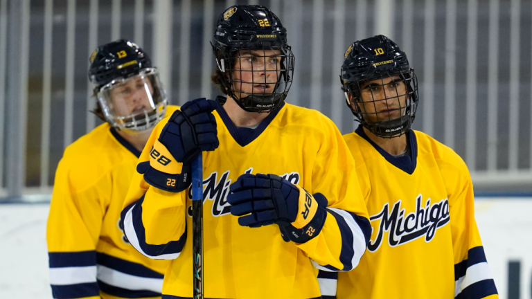 University of Michigan's Kent Johnson, from left, Owen Power and Matty Beniers watch during an NCAA college hockey practice in Ann Arbor, Mich., Wednesday, Sept. 22, 2021. (AP/file)