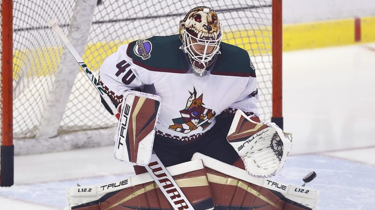 Arizona Coyotes goaltender Carter Hutton (40) warms up before an NHL hockey game against the Florida Panthers, Monday, Oct. 25, 2021, in Sunrise, Fla. (AP Photo/Michael Reaves)