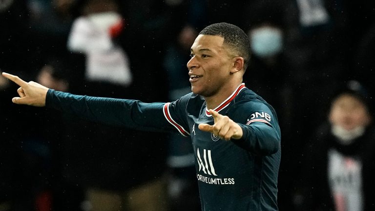 PSG's Kylian Mbappe celebrates after scoring his side's opening goal during the Champions League, round of 16, first leg soccer match between Paris Saint Germain and Real Madrid at the Parc des Princes stadium, in Paris, France, Tuesday, Feb. 15, 2022. (Thibault Camus/AP)